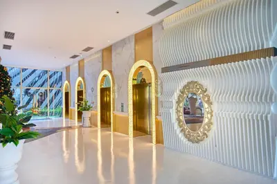 a lobby with gold doors and a mirror on the wall at Arte Mont Kiara Free Parking, Kuala Lumpur in Kuala Lumpur