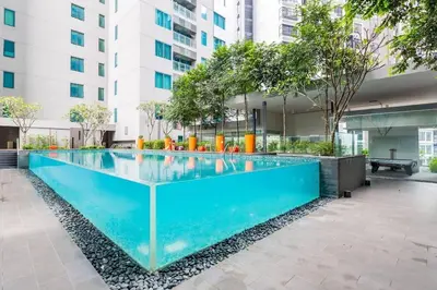 a swimming pool in the middle of a building at Mercu Summer Suites KLCC 2BR Pastel Rose in Kuala Lumpur