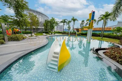 a swimming pool with a slide in a resort at Trion Premier Suites Kuala Lumpur in Kuala Lumpur