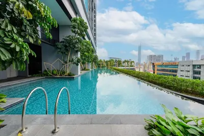 a swimming pool on the side of a building at Trion Premier Suites Kuala Lumpur in Kuala Lumpur