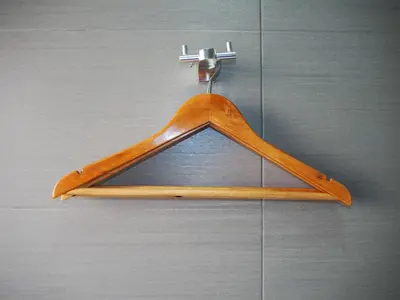 a wooden hanger is hanging on a wall at Leo Leisure Hotel @ Central Market in Kuala Lumpur