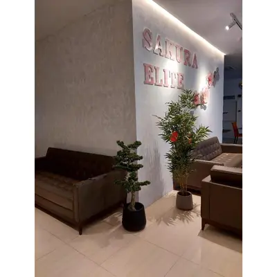 a lobby with couches and potted plants in a store at Sakura Elite Kuala Lumpur in Kuala Lumpur