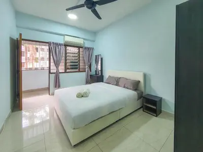 a bedroom with a bed with two pillows on it at Cozy Place-Rumah Nyaman - Bukit Bintang by Shine Stay in Kuala Lumpur