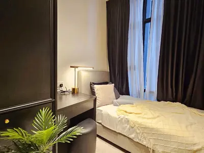 a bedroom with a bed and a desk and a chair at Axon Suite Bukit Bintang 3Bed Room Suites ,5min Pavillion KL in Kuala Lumpur