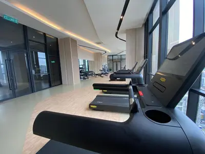 a gym with several treadmills in a building at The Axon Bukit Bintang Residence by De Space in Kuala Lumpur
