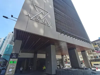 a building with a sign on the side of it at The Axon Bukit Bintang Residence by De Space in Kuala Lumpur