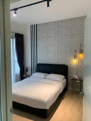 a bedroom with a large white bed with a headboard at FHS Homestay @ Arte Plus Jalan Ampang T1-40-02 in Kuala Lumpur