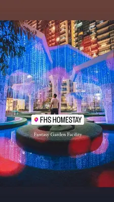 a man is standing in front of a building at FHS Homestay @ Arte Plus Jalan Ampang T1-40-02 in Kuala Lumpur