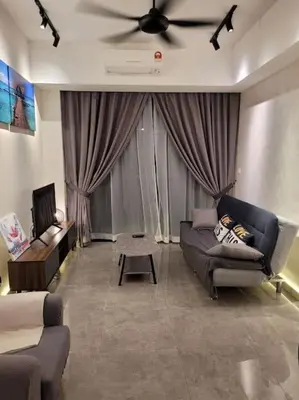 a living room with a couch and a ceiling fan at OOAK Residence at Mont Kiara in Kuala Lumpur