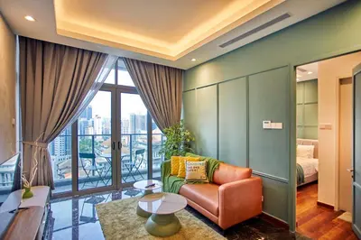 a living room with a couch and a large window at Royce Residence KLCC by Cobnb in Kuala Lumpur