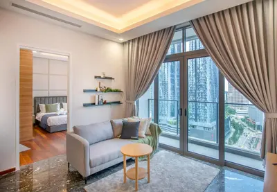 a living room with a couch and a table at Royce Residence KLCC by Cobnb in Kuala Lumpur
