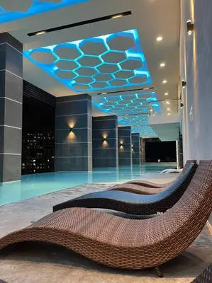 a lobby with a couch in the middle of a building at KL Sunway Velocity 1-5pax connected to Mall & MRT in Kuala Lumpur