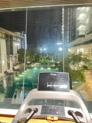 a view of a city street from a vehicle with a laptop at KL Sunway Velocity 1-5pax connected to Mall & MRT in Kuala Lumpur