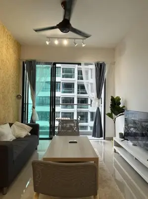 a living room with a couch and a table at KL Sunway Velocity 1-5pax connected to Mall & MRT in Kuala Lumpur
