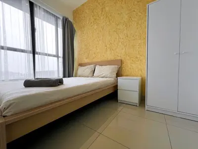 a bedroom with a large bed with a window at Lavile @ Sunway Velocity Mall in Kuala Lumpur