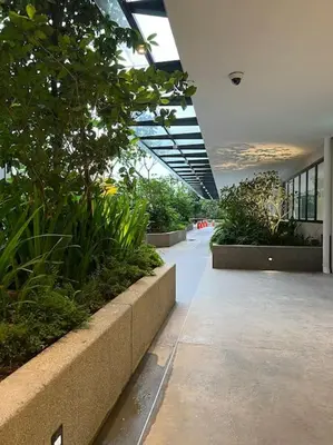 a hallway in a building with plants andotics at Lavile @ Sunway Velocity Mall in Kuala Lumpur