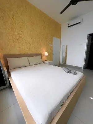 a bedroom with a large white bed in a room at Lavile @ Sunway Velocity Mall in Kuala Lumpur