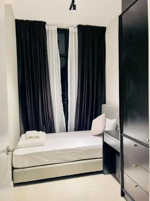 a small bedroom with a bed and a window at Axon Bukit Bintang By Moonlight in Kuala Lumpur