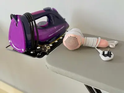 a hair dryer and a hair brush on a table at 3 Towers Jalan Ampang By Serenity Vacation Homes in Kuala Lumpur