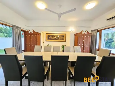 a large dining room with a table and chairs at Bangsar Three Storey Luxury Landed House 19PAX in Kuala Lumpur