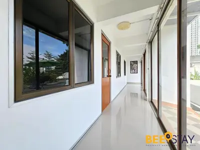 a hallway of a house with large windows at Bangsar Three Storey Luxury Landed House 19PAX in Kuala Lumpur