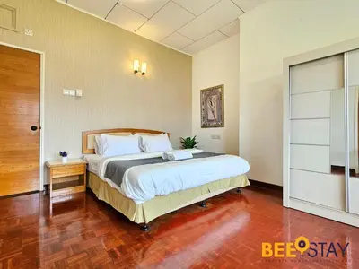 a bedroom with a large bed in a room at Bangsar Three Storey Luxury Landed House 19PAX in Kuala Lumpur