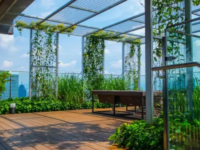 a glass conservatory with a bench in a building at Ceylonz Suite Kuala Lumpur Bukit Bintang in Kuala Lumpur