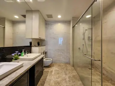 a bathroom with a shower and a sink and a toilet at The Platinum KLCC By Victoria Home in Kuala Lumpur