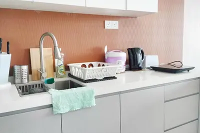 a kitchen counter top with a sink and a sink at Central KL Retreat MyTown Ikea KLCC TRX Mall MRT in Kuala Lumpur
