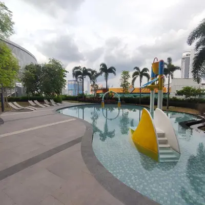 a swimming pool with a yellow and white boat in it at TRION studio 4 PAX tenseven in Kuala Lumpur