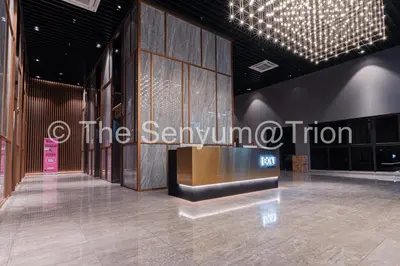 a lobby of a store with a sign that reads the seymillion at TRION studio 4 PAX tenseven in Kuala Lumpur