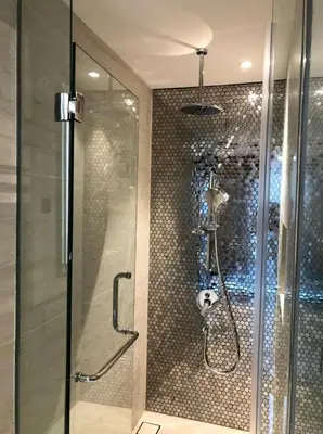a shower with a glass door in a bathroom at Star Residence KlCC By M&T in Kuala Lumpur