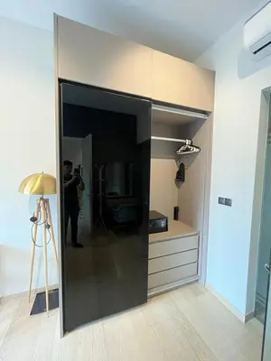 a man taking a picture of a room at Star Residence KlCC By M&T in Kuala Lumpur