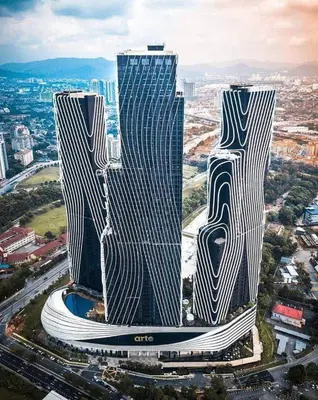 two tall skyscrapers in a city with buildings at Anggun Arte Mont Kiara in Kuala Lumpur