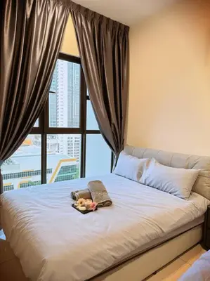 a bed in a room with a large window at 2R2B*1-6+1 Pax*KL City*10mins-KLCC in Kuala Lumpur
