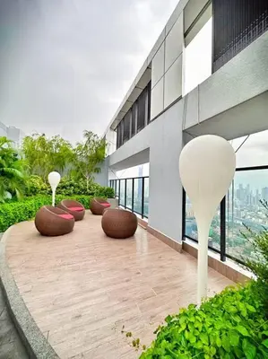 a row of chairs sitting on top of a building at 2R2B*1-6+1 Pax*KL City*10mins-KLCC in Kuala Lumpur
