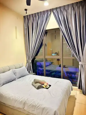 a person laying on a bed in a bedroom at 2R2B*1-6+1 Pax*KL City*10mins-KLCC in Kuala Lumpur