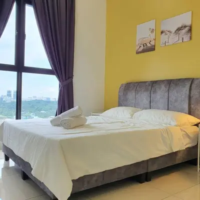a bed in a room with a large window at Chill-houz KL Trion 6P 2BR - 5-mins MRT - TRX Mall in Kuala Lumpur