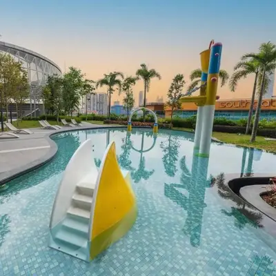a water park with a slide in a pool at Chill-houz KL Trion 6P 2BR - 5-mins MRT - TRX Mall in Kuala Lumpur