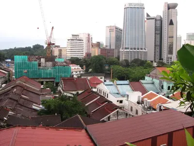 a view of a city with buildings and roofs at Oasis Guest House in Kuala Lumpur