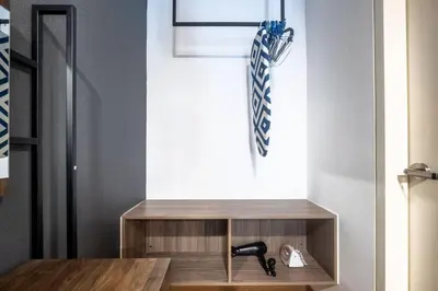 a room with a wooden table and a window at Duplex Industrial Loft 5pax above Eko Cheras Mall in Kuala Lumpur