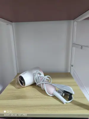 a appliance is laying on the floor in a drawer at HaNi Homestay KL in Kuala Lumpur