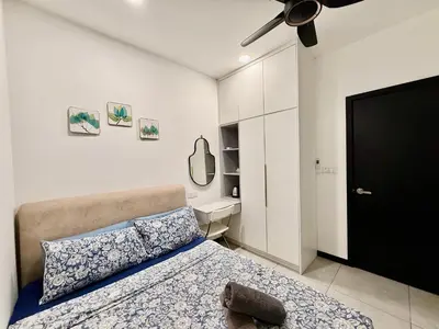 a bedroom with a bed and a ceiling fan at Couple Suite at Neu Suites near Gleneagles in Kuala Lumpur