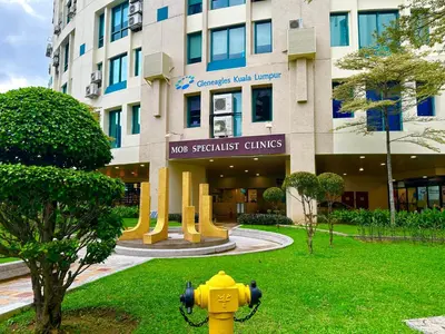 a yellow fire hydrant in front of a building at Couple Suite at Neu Suites near Gleneagles in Kuala Lumpur