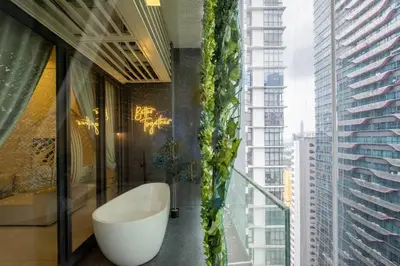 a bathroom with a large window with a bath tub at The Element Ampang in Kuala Lumpur