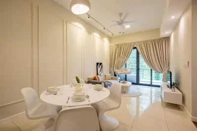 a living room with a white table and chairs at The Element Ampang in Kuala Lumpur