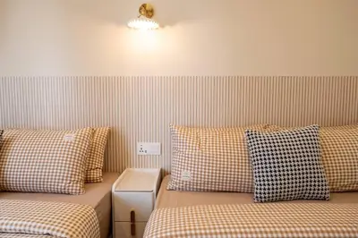 two beds sitting next to each other in a room at The Element Ampang in Kuala Lumpur