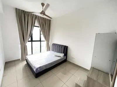 a bedroom with a bed and a window at Trion KL in Kuala Lumpur