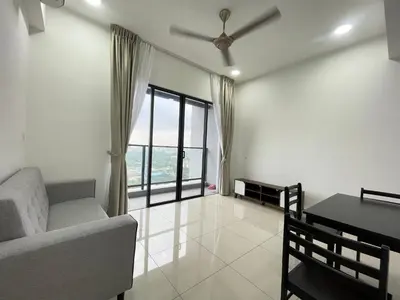 a living room with a couch and a table and a window at Trion KL in Kuala Lumpur