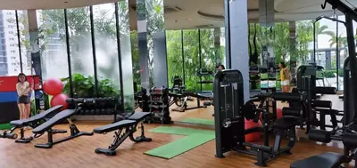 a gym with a bunch of treadmills and exercise bikes at Trion KL in Kuala Lumpur